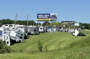 Several camper trailers from Trailside RV along Interstate 70 in Grain Valley got moved or damaged by tornado winds late Monday. The National Weather Service had surveyors assessing storm damage spots Tuesday to determine if tornadoes had occurred. [Mike Genet/The Examiner]