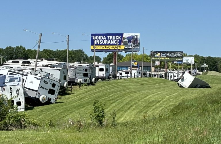 Several camper trailers from Trailside RV along Interstate 70 in Grain Valley got moved or damaged by tornado winds late Monday. The National Weather Service had surveyors assessing storm damage spots Tuesday to determine if tornadoes had occurred. [Mike Genet/The Examiner]